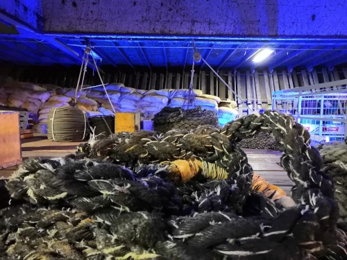 A pile of rope work in a loading bay.