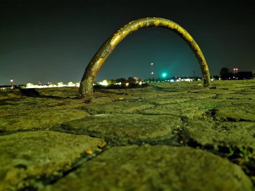 A lonely arch in the middle of the night.